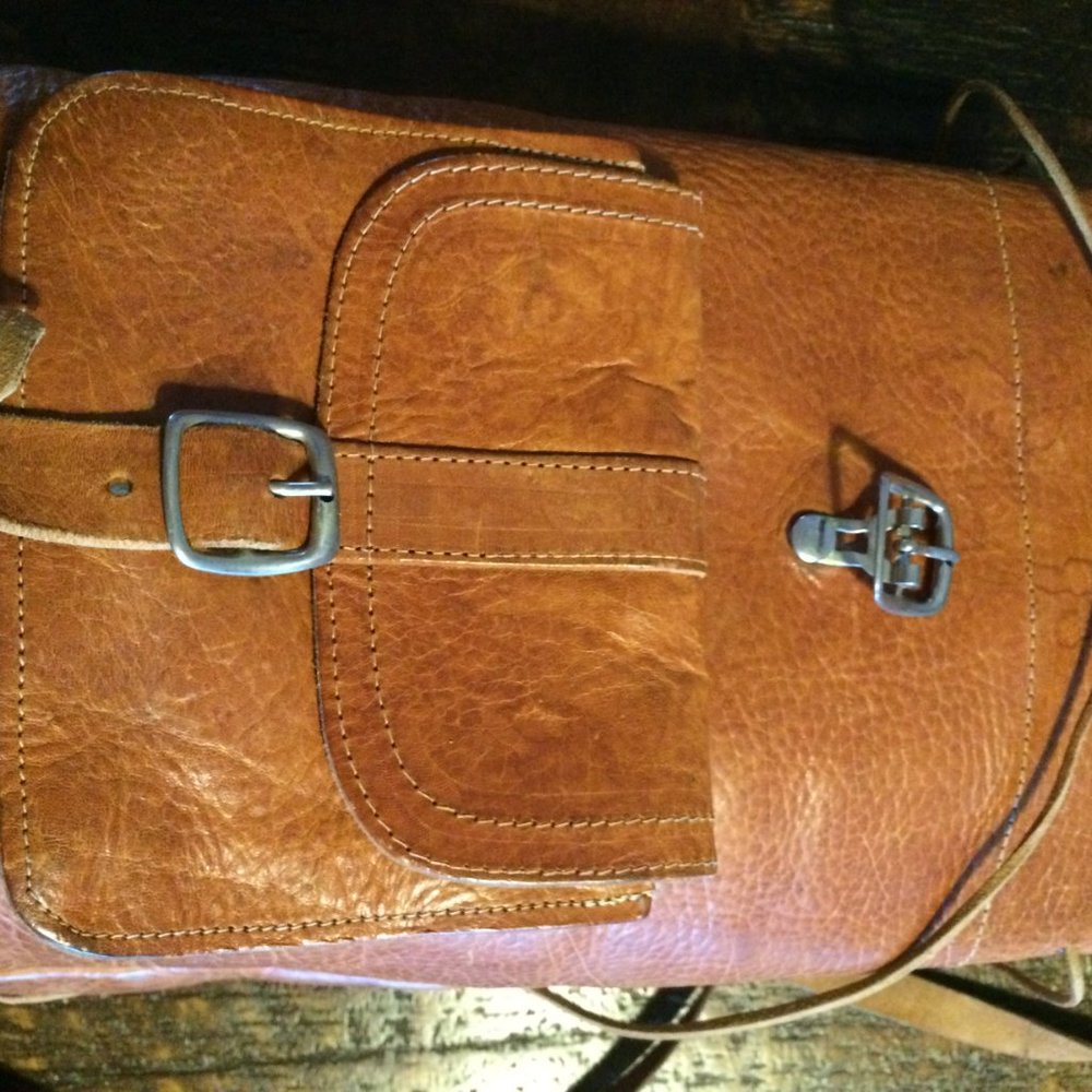 Small brown handmade leather backpack